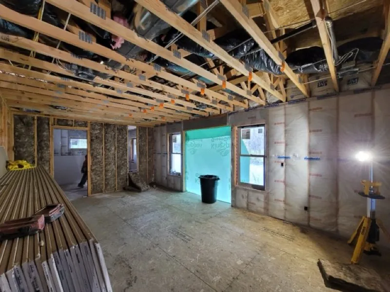 Home addition in progress: new framing and insulation by OJEG Construction