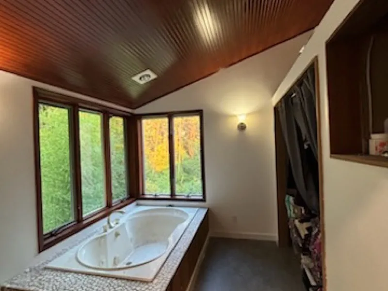 After: the restored bathroom with new windows and refinished ceiling